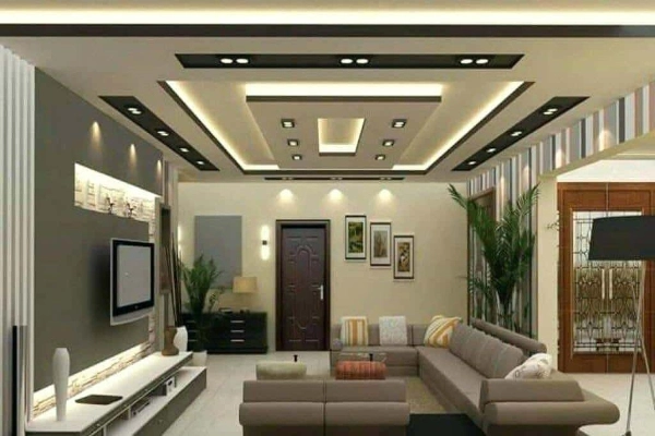 The Living room boasts an eye-catching false ceiling