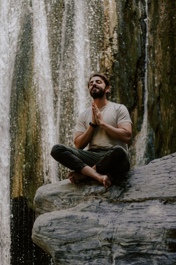 A serene moment of meditation by a waterfall in Osmaniye, Türkiye.